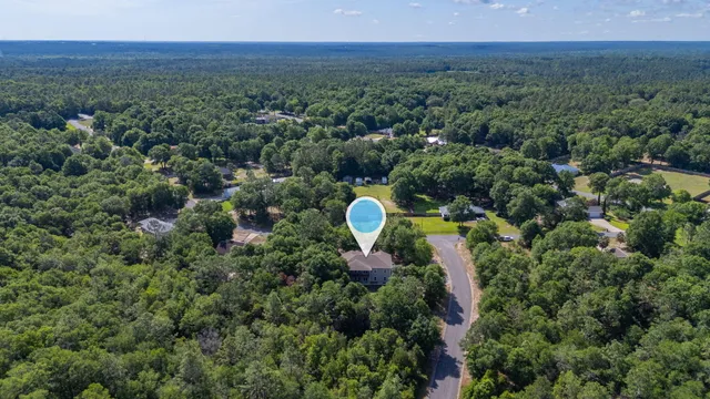 an aerial view of a house with a garden