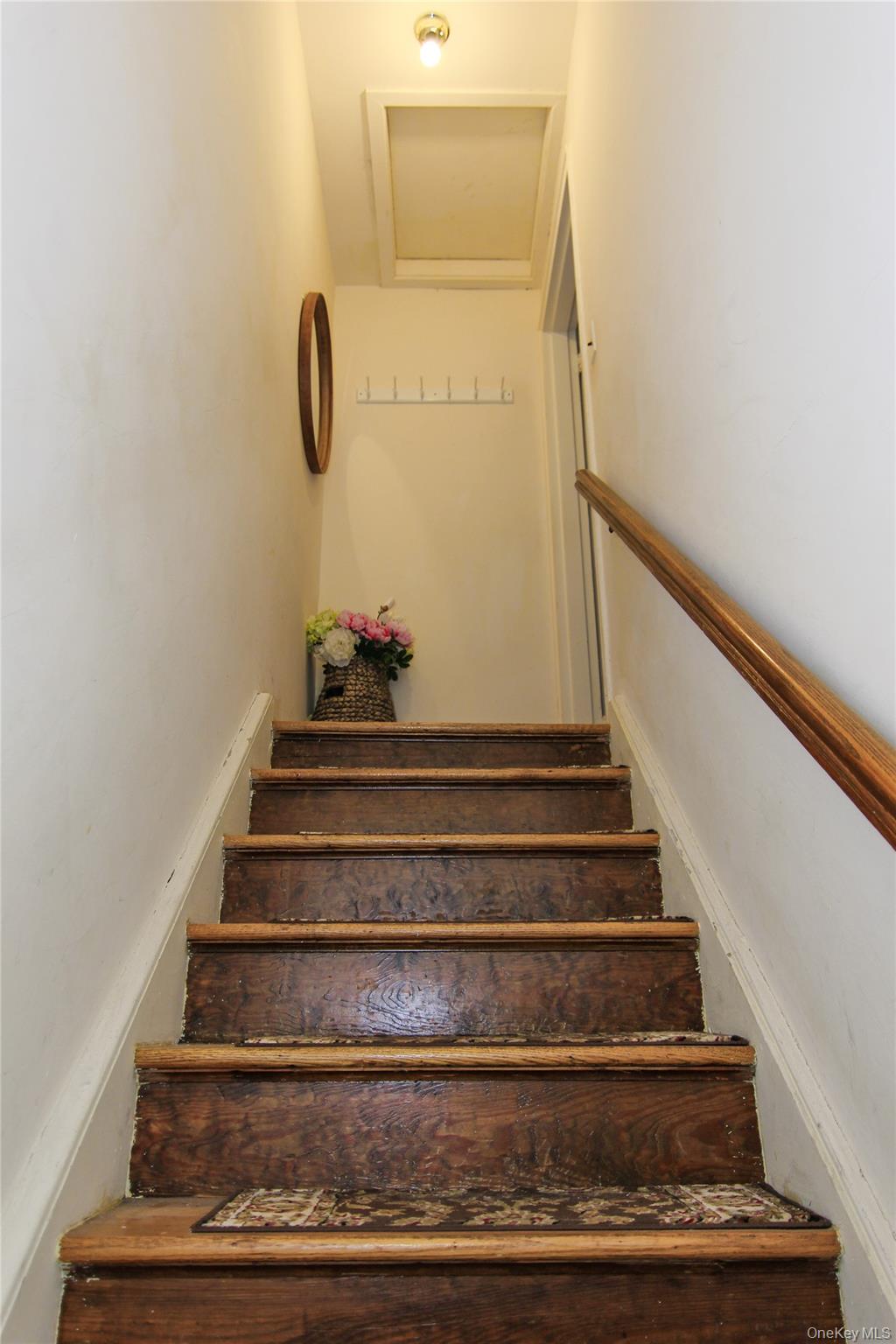 102 Spruce Street, Unit 2A Yonkers, NY 10701 - Photo 3 of 12 a view of staircase with white walls and railing