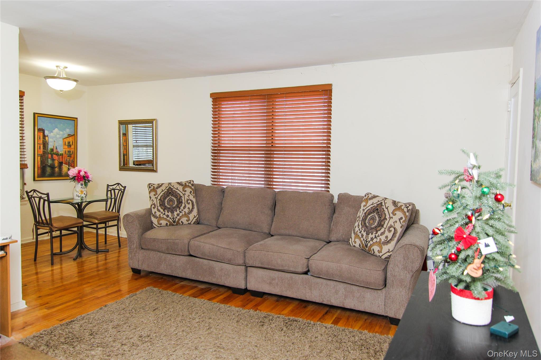 102 Spruce Street, Unit 2A Yonkers, NY 10701 - Photo 4 of 12 a living room with furniture and a potted plant