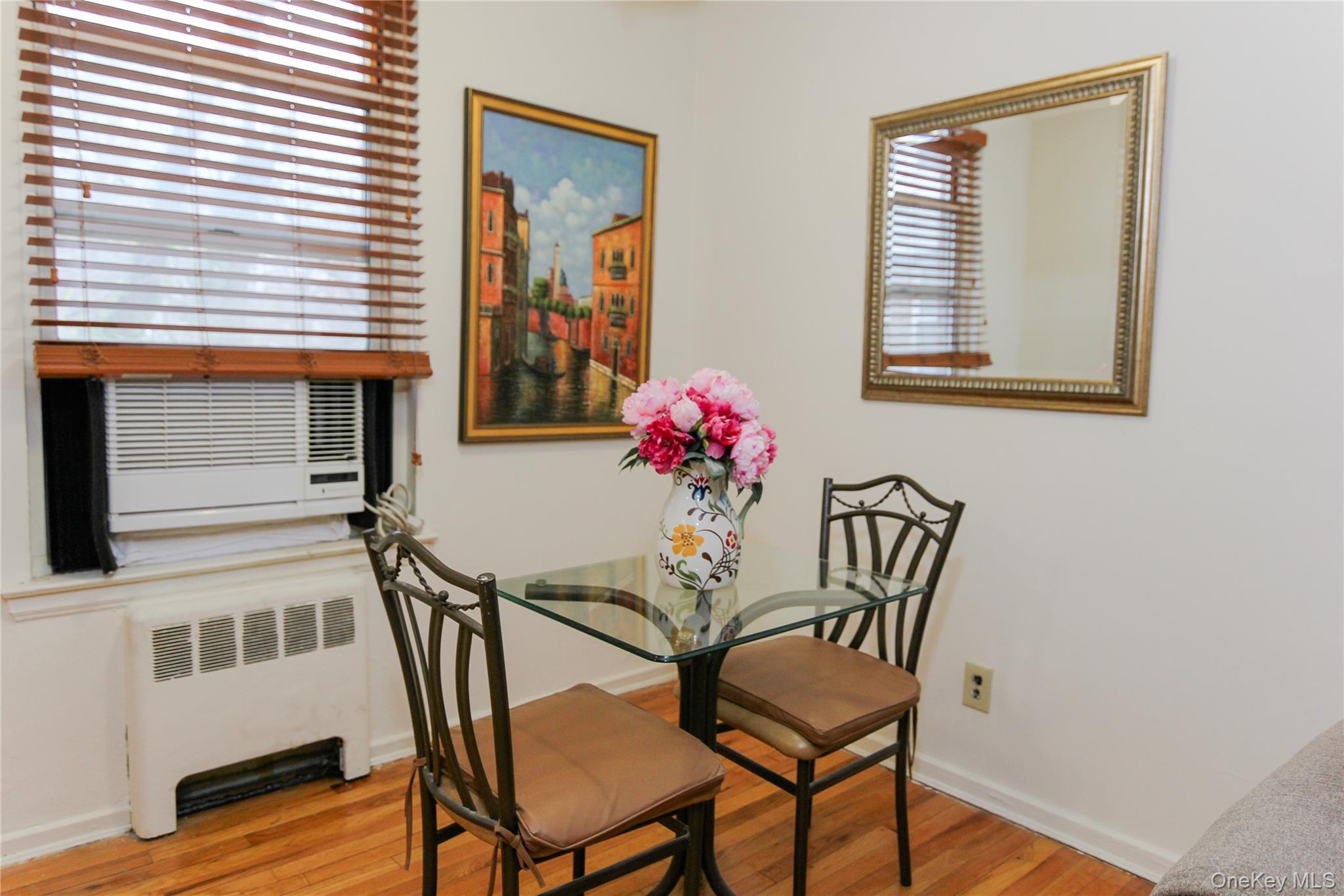 102 Spruce Street, Unit 2A Yonkers, NY 10701 - Photo 6 of 12 a view of a dining room with furniture and wooden floor