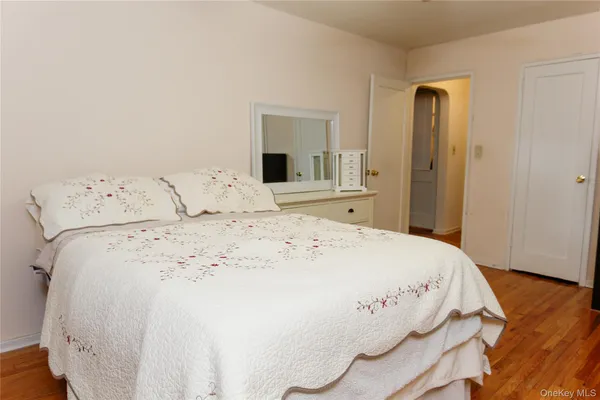 a large white bed in a white room