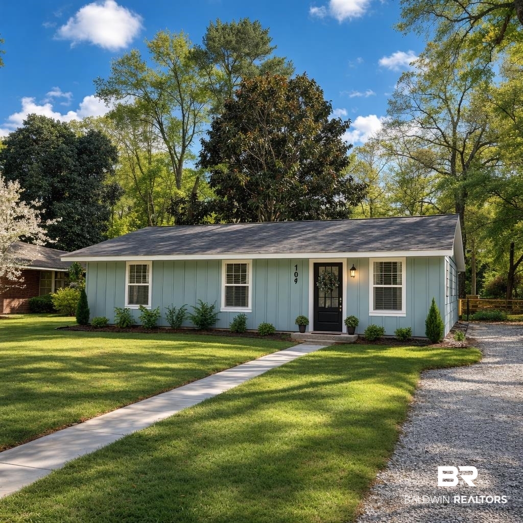107 Dawson Street Brewton, AL 36426 - Photo 1 of 15 Single story home featuring board and batten siding, a front lawn, and a shingled roof