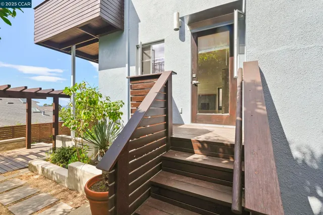 a kitchen with stainless steel appliances a refrigerator sink and stove