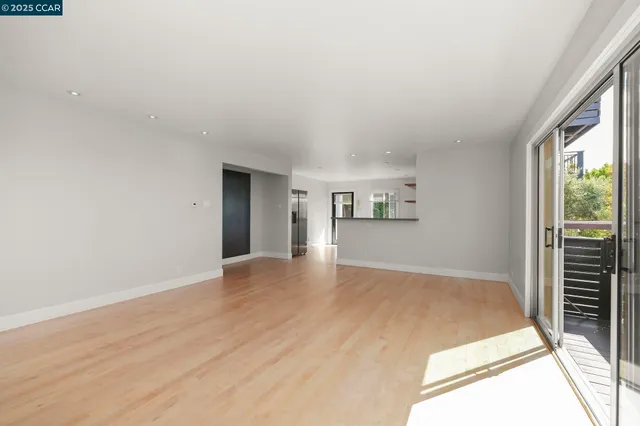 a kitchen with stainless steel appliances a sink and a refrigerator