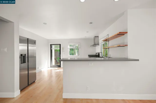 a kitchen with stainless steel appliances granite countertop a stove and a sink