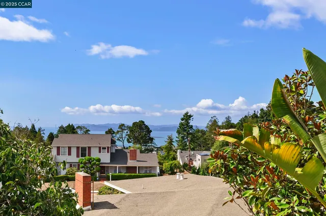 a view of a backyard with sitting area