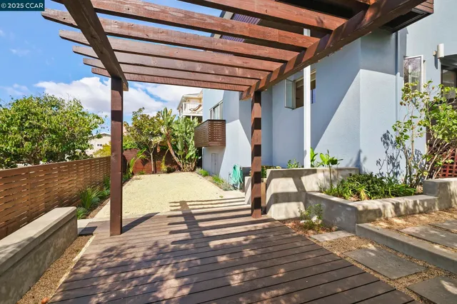 a view of a house with a yard and garden