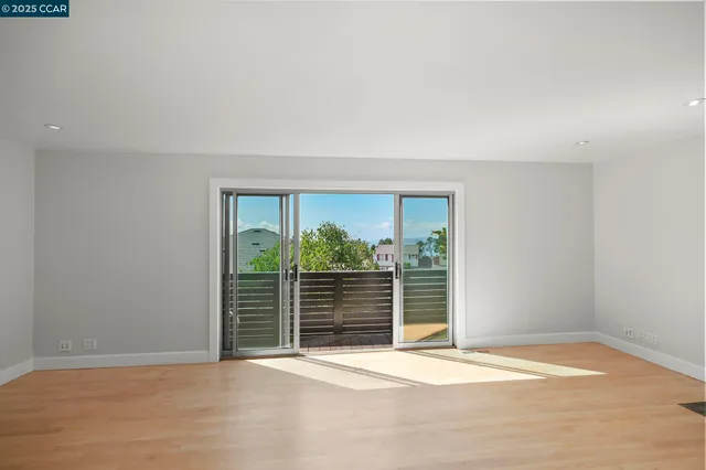 a view of a house with a yard and potted plants
