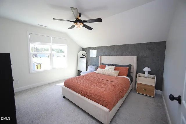 a bedroom with a bed and window