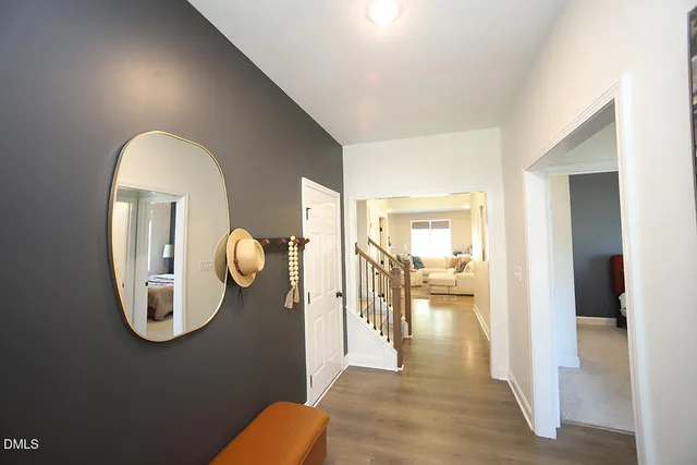 a view of livingroom and dining room with wooden floor