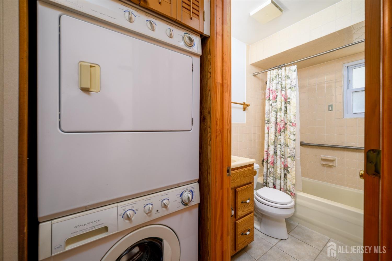 34 Kenmore Road Edison, NJ 08817 - Photo 18 of 22 a white toilet sitting next to a bathroom sink