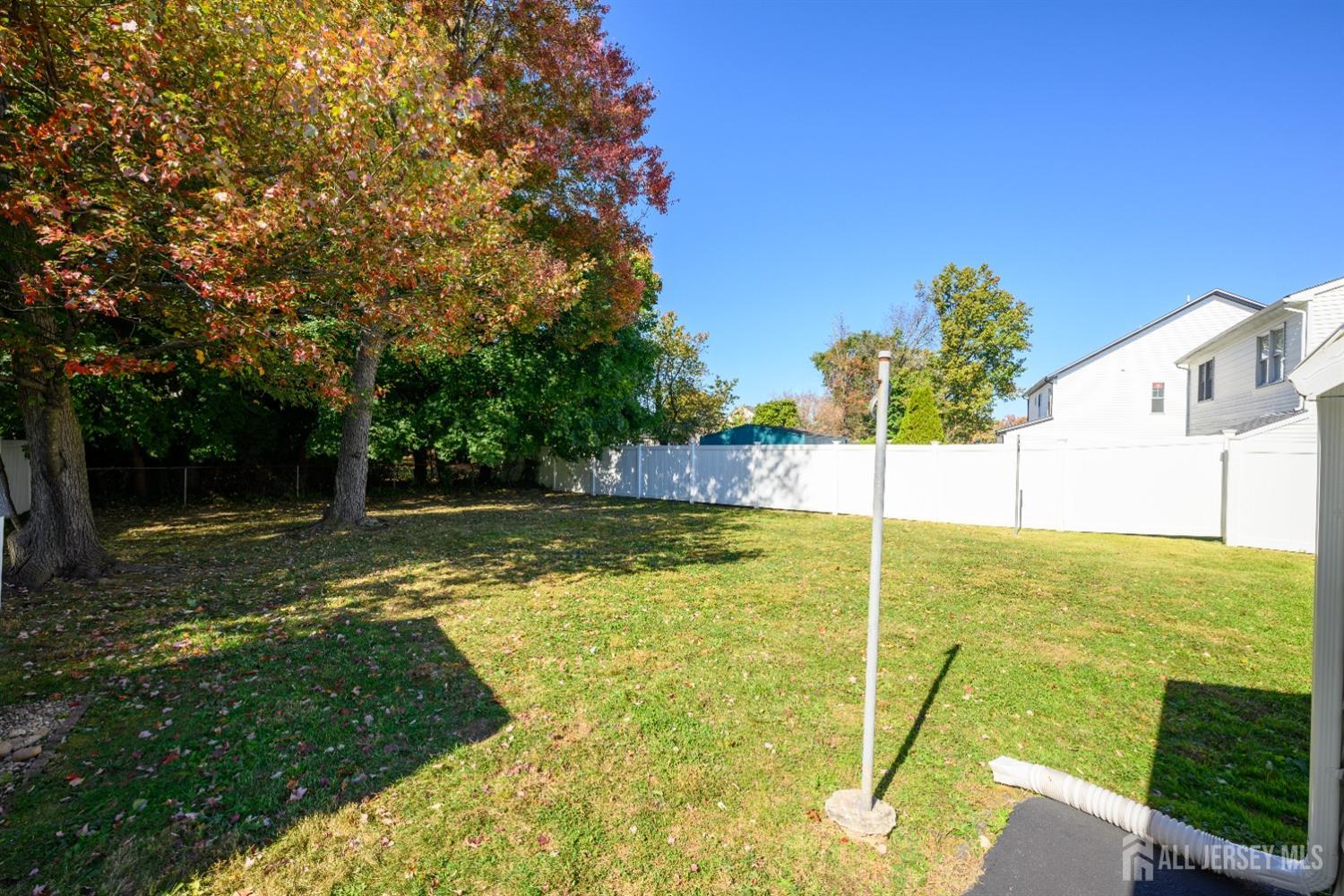 34 Kenmore Road Edison, NJ 08817 - Photo 4 of 22 a view of a swimming pool with a garden