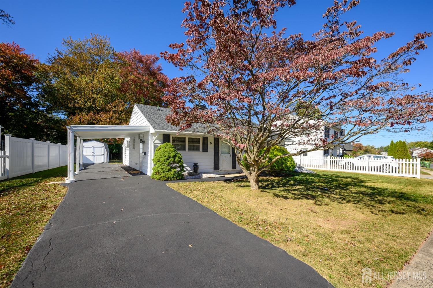 34 Kenmore Road Edison, NJ 08817 - Photo 5 of 22 a view of a house with a yard and tree s