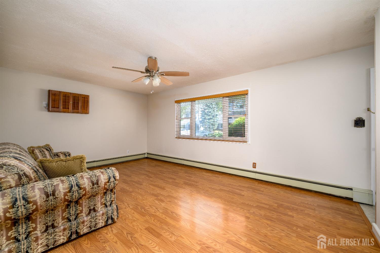 34 Kenmore Road Edison, NJ 08817 - Photo 8 of 22 a view of room with window and ceiling fan