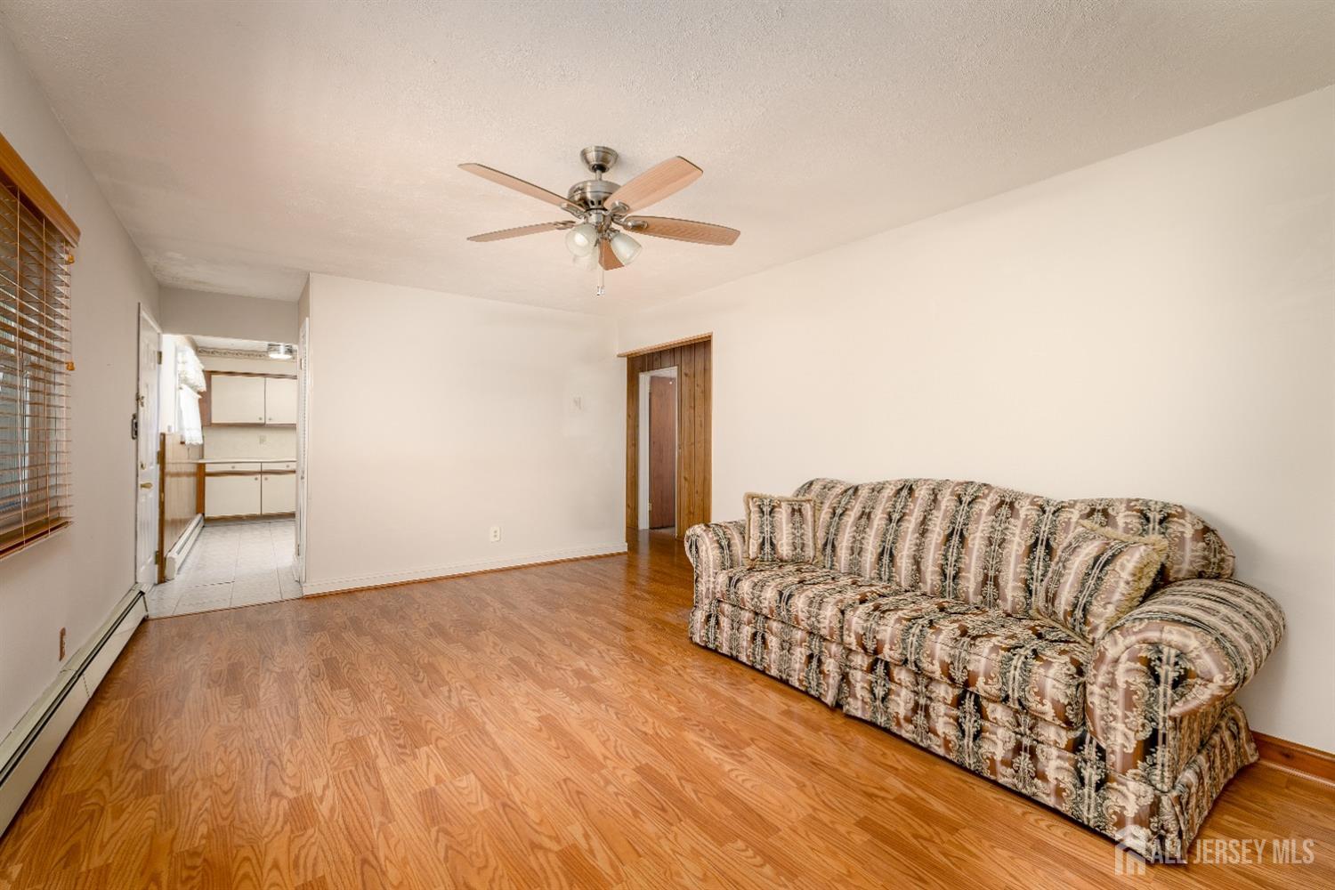 34 Kenmore Road Edison, NJ 08817 - Photo 9 of 22 a living room with a couch