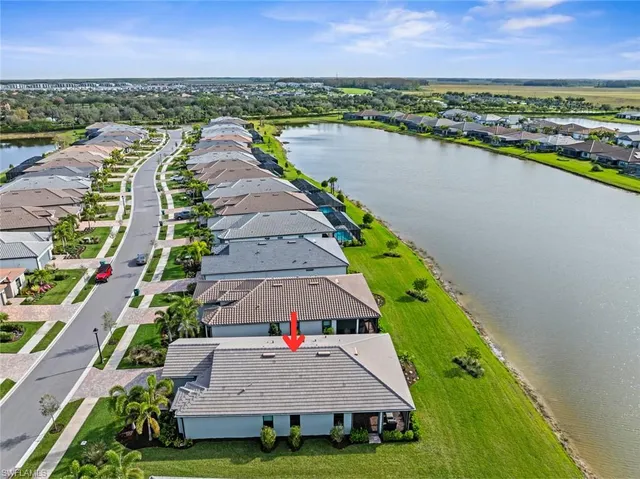 an aerial view of a house with a lake view