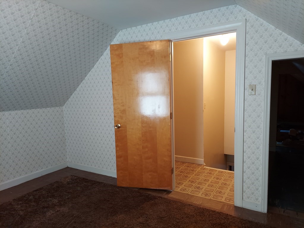 13 Saybrook Road Worcester, MA 01604 - Photo 15 of 40 an empty room with wooden floor closet and windows