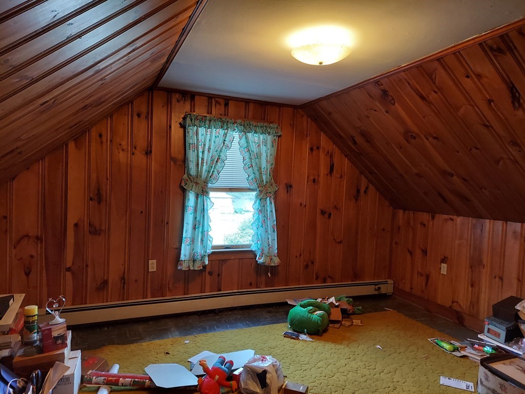 13 Saybrook Road Worcester, MA 01604 - Photo 17 of 40 a room with water heater and wooden cabinets