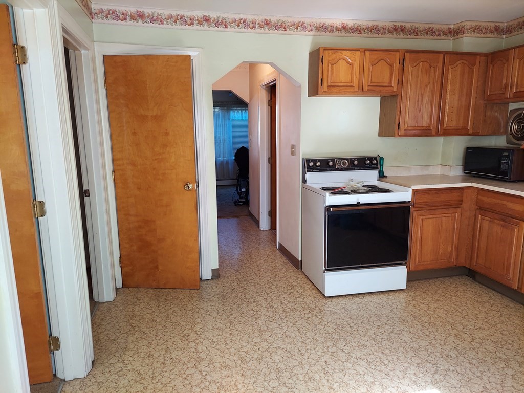 13 Saybrook Road Worcester, MA 01604 - Photo 6 of 40 a kitchen with stainless steel appliances granite countertop a refrigerator and a stove