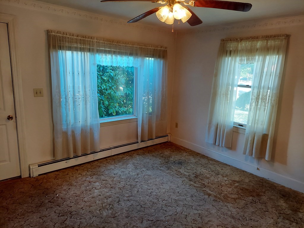 13 Saybrook Road Worcester, MA 01604 - Photo 10 of 40 an empty room with windows and yard