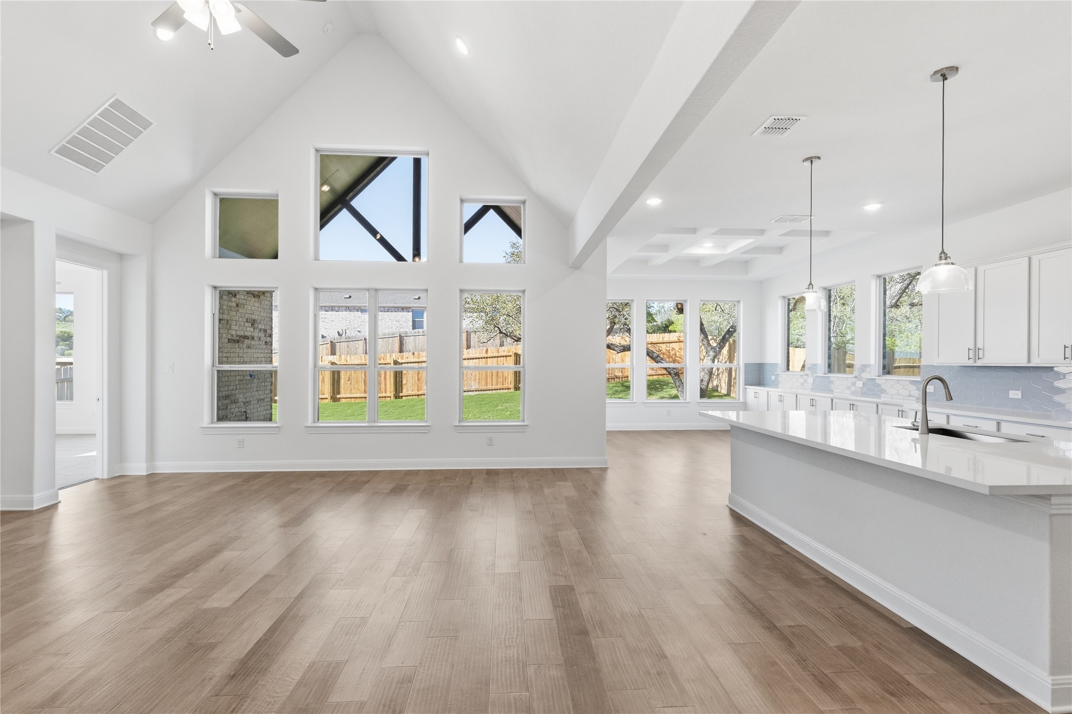 308 Frio Spgs Trail Georgetown, TX 78628 - Photo 11 of 32 a view of a kitchen with wooden floor and windows