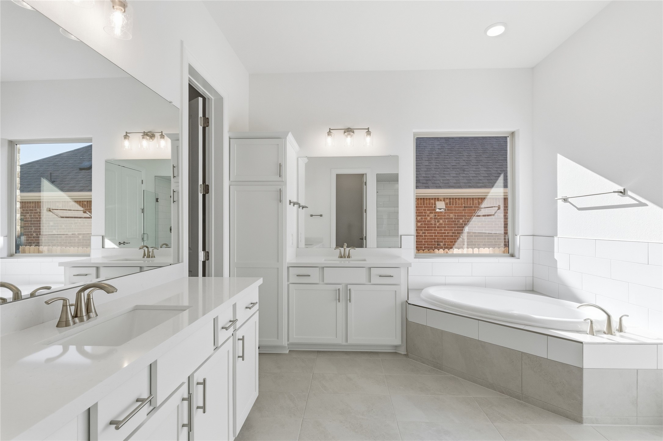 308 Frio Spgs Trail Georgetown, TX 78628 - Photo 17 of 32 a bathroom with a granite countertop sink mirror and bathtub