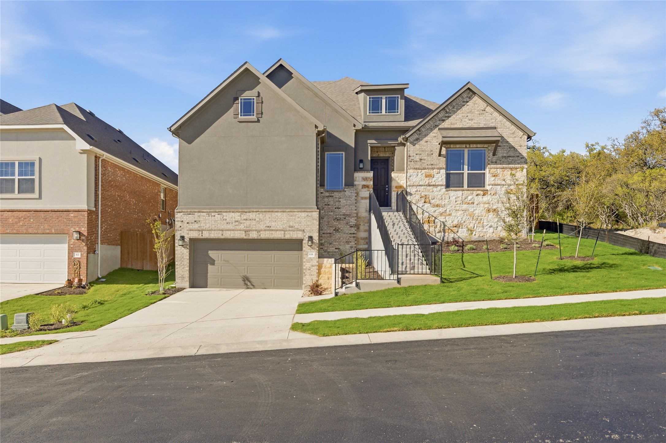 308 Frio Spgs Trail Georgetown, TX 78628 - Photo 2 of 32 a front view of a house with a yard and staircase