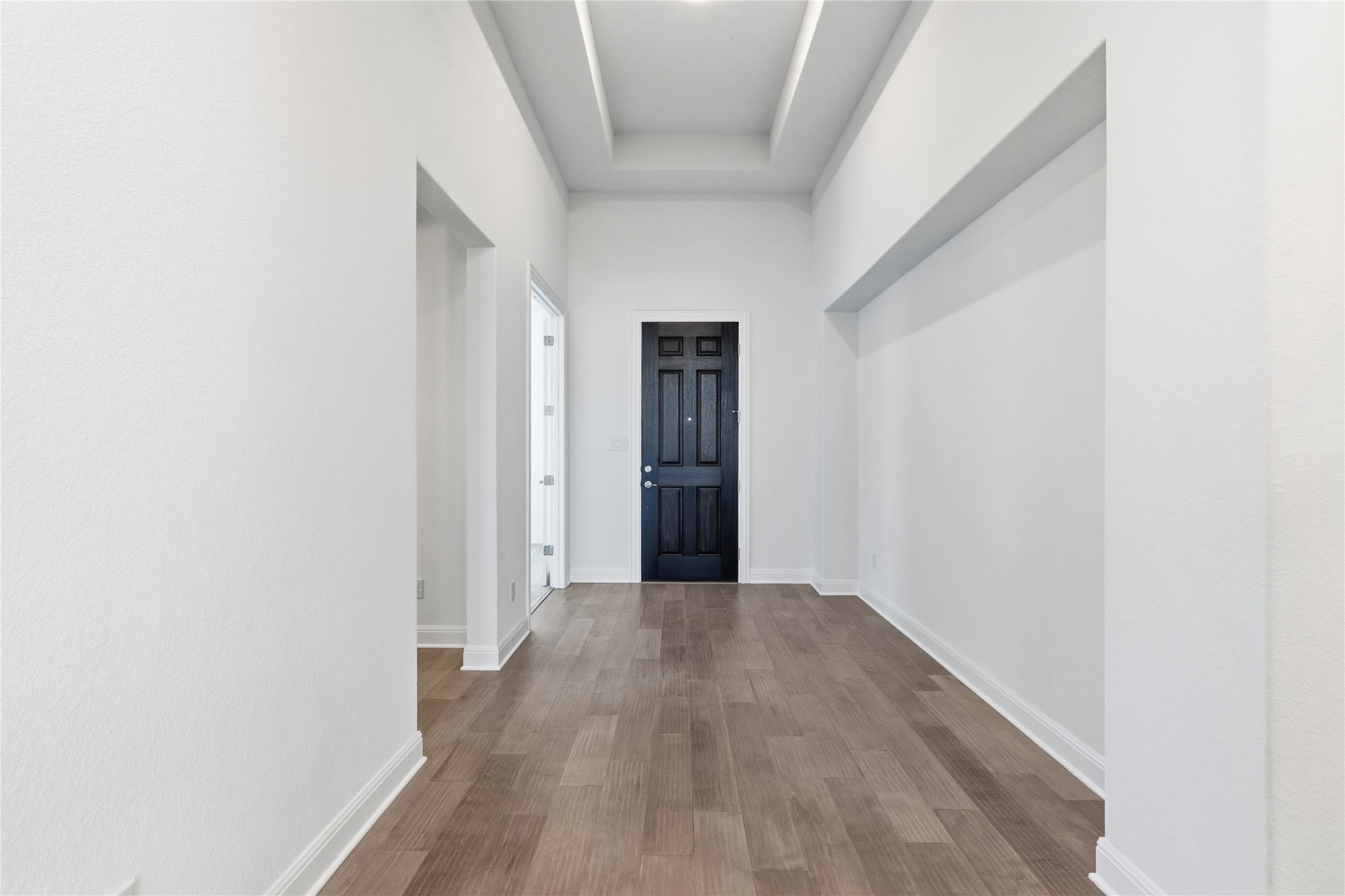 308 Frio Spgs Trail Georgetown, TX 78628 - Photo 21 of 32 a view of a hallway with wooden floor