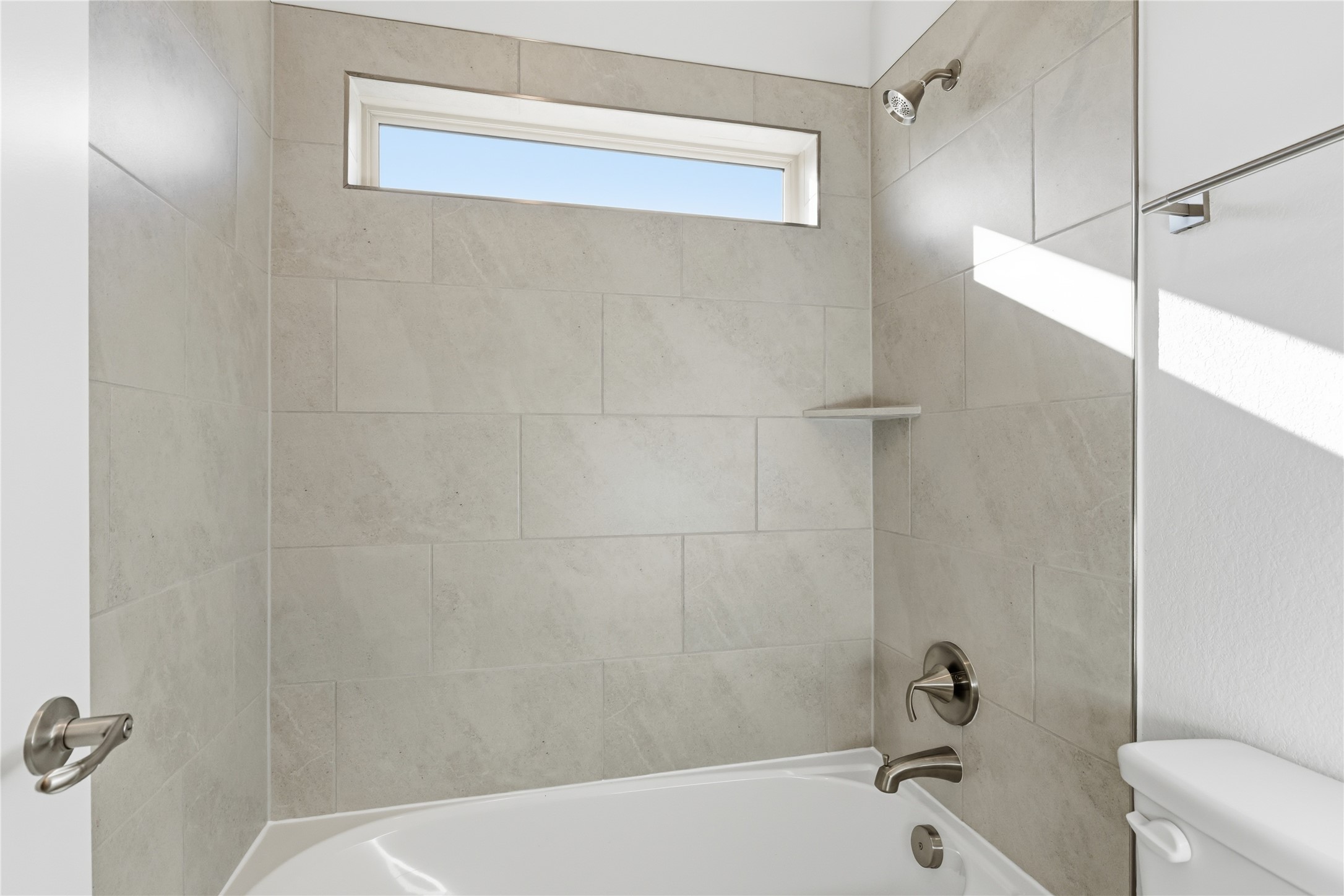 308 Frio Spgs Trail Georgetown, TX 78628 - Photo 26 of 32 a bathroom with a bathtub and a shower