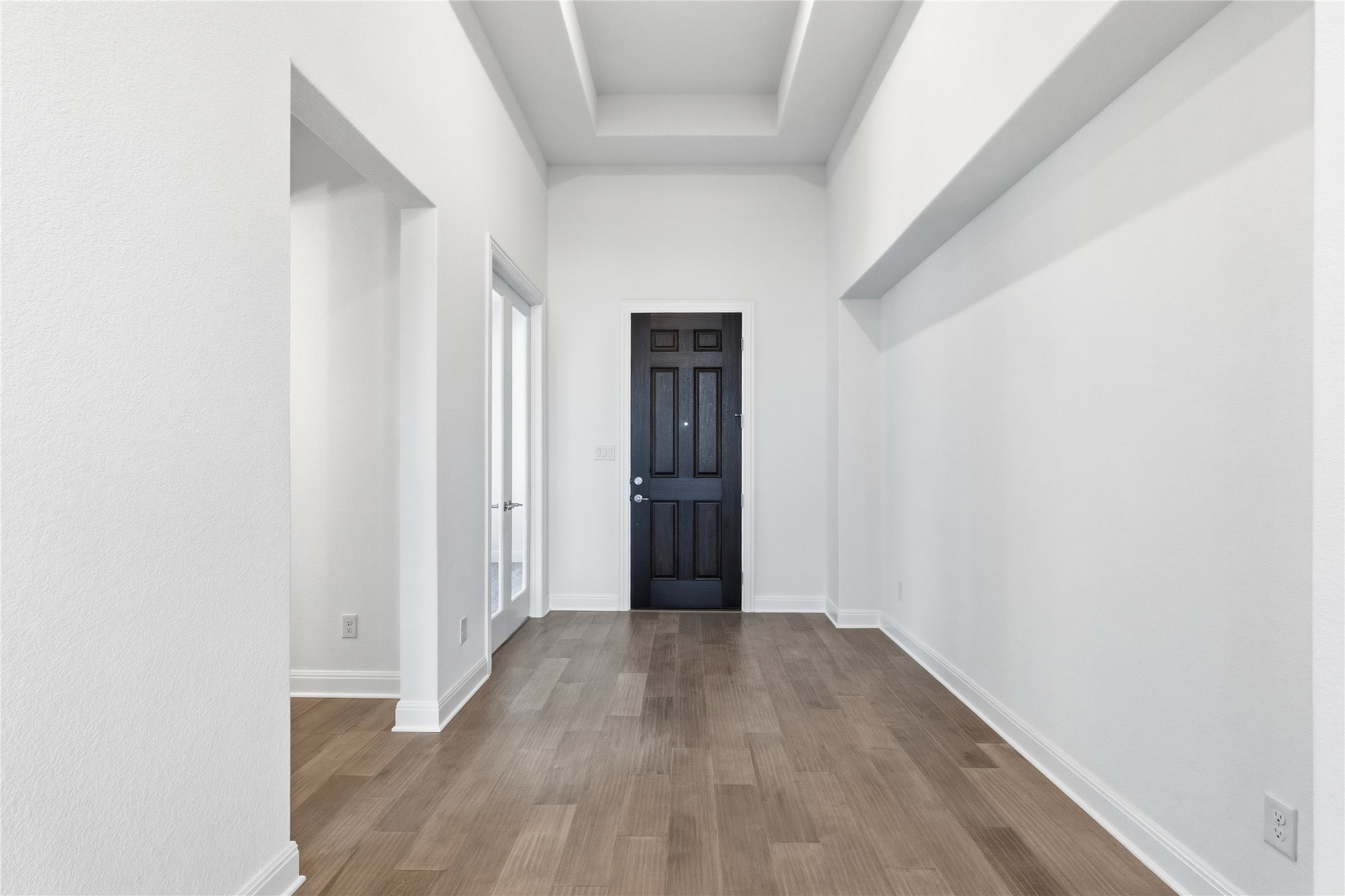 308 Frio Spgs Trail Georgetown, TX 78628 - Photo 4 of 32 a view of an empty room with wooden floor