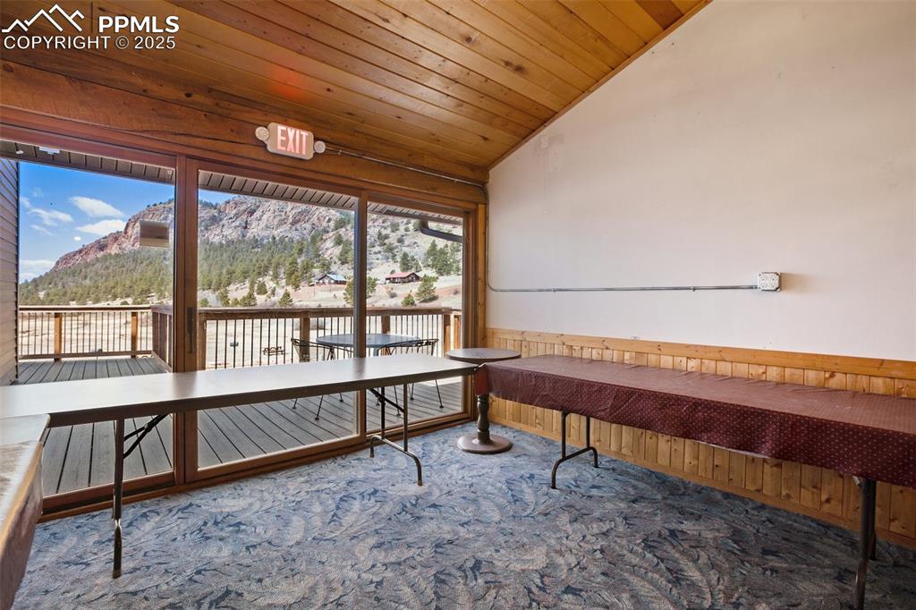 1289 Yorktown Road Cripple Creek, CO 80813 - Photo 33 of 35 a view of a room with wooden floor and windows