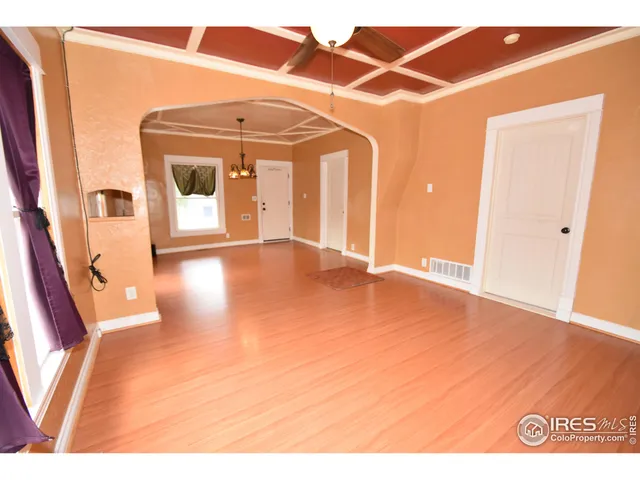 a kitchen with stainless steel appliances granite countertop a stove a sink and white cabinets