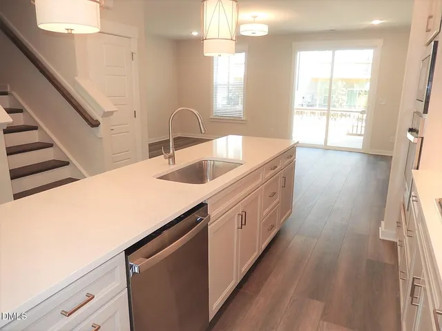 a kitchen with sink and window