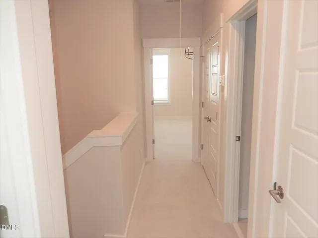 a view of a bathroom from a hallway