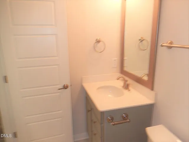a bathroom with a sink and mirror
