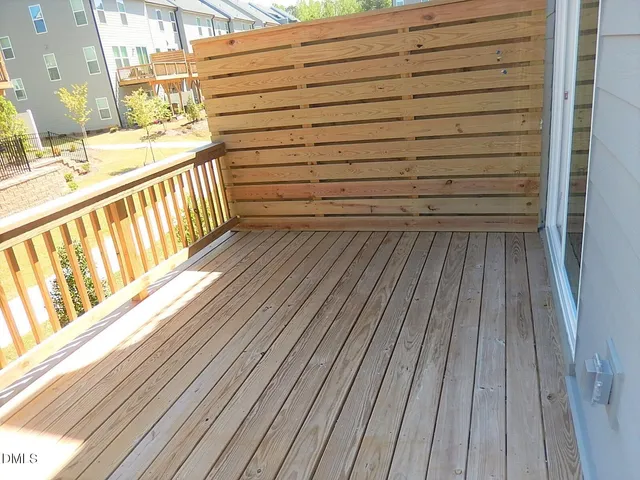 a view of a balcony with wooden floor