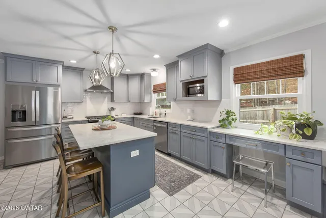a kitchen with sink cabinets and window