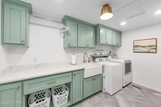 a kitchen with a sink cabinets and window