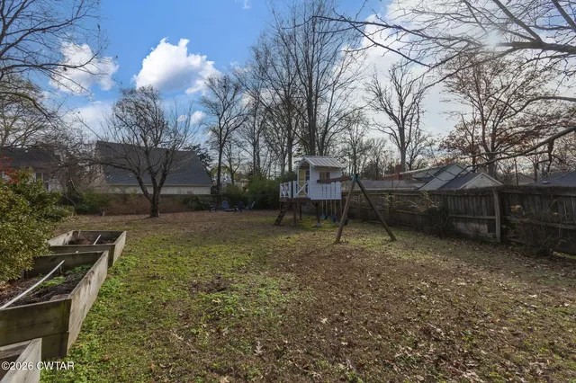 a view of a backyard with trees