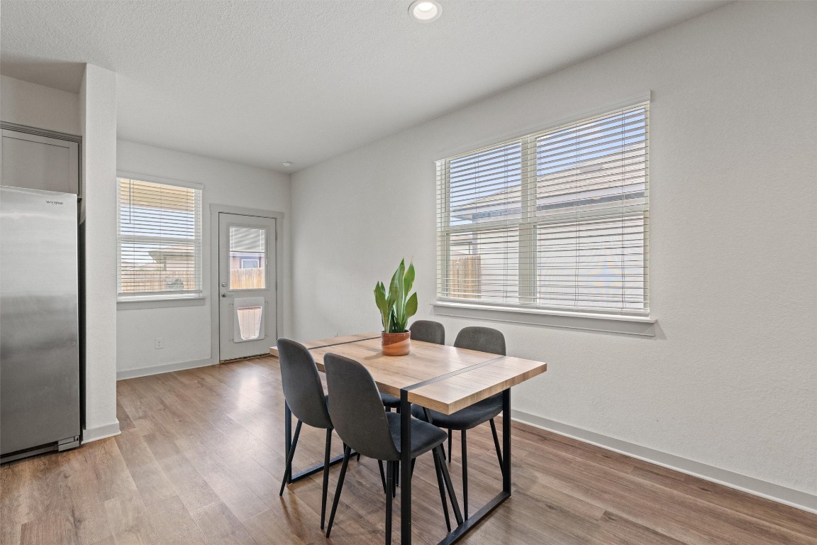 121 Tequilana Pass Leander, TX 78641 - Photo 11 of 39 a dining room with furniture and window