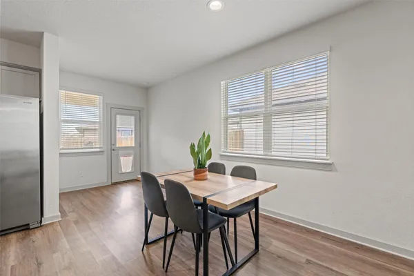 a dining room with furniture and window