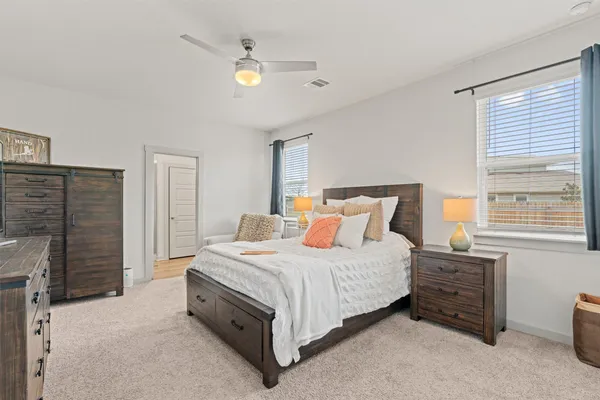 a bedroom with a bed and a fireplace