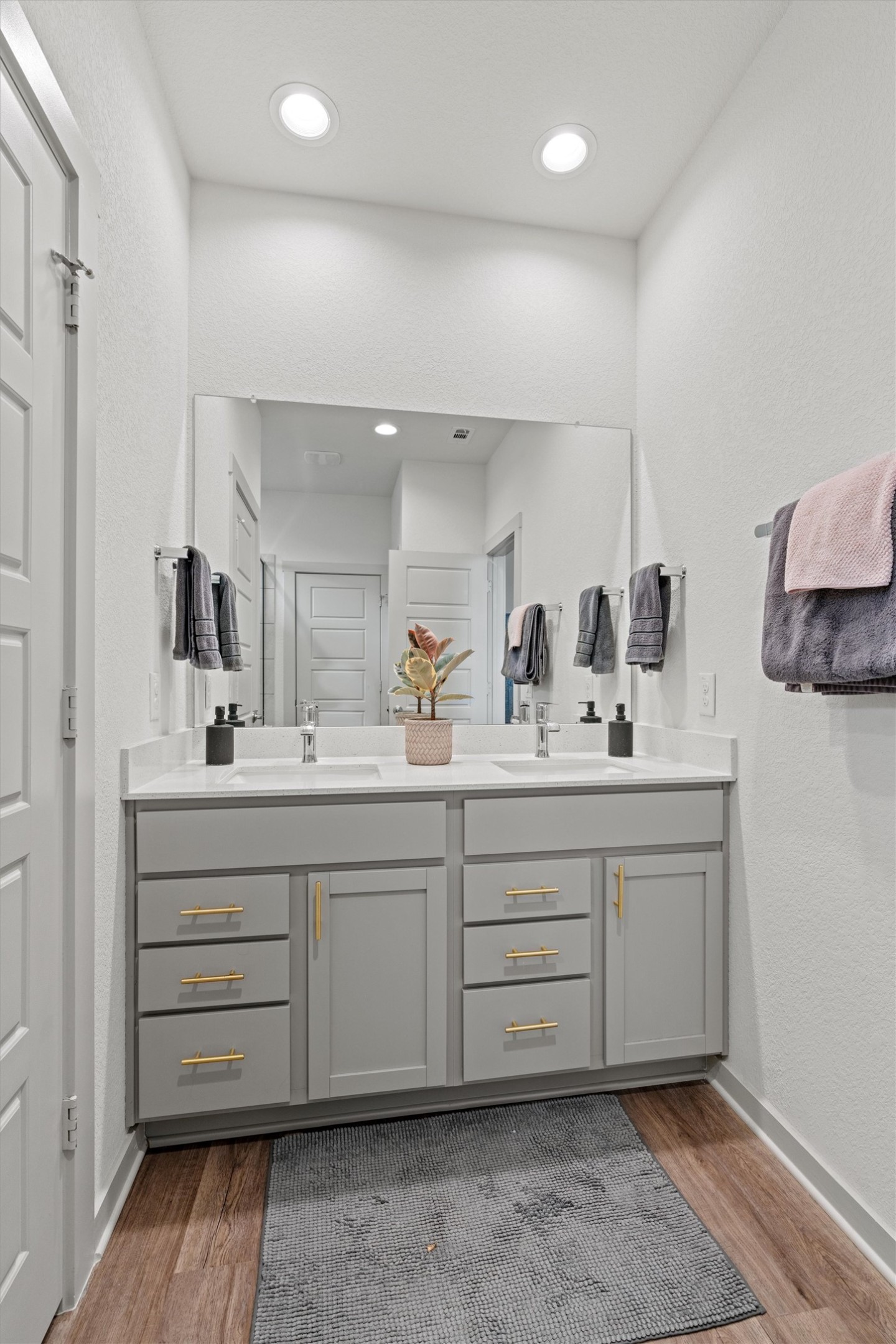 121 Tequilana Pass Leander, TX 78641 - Photo 17 of 39 a bathroom with a sink vanity and mirror