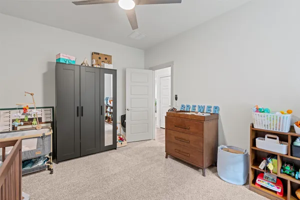 a room with furniture and a book shelf