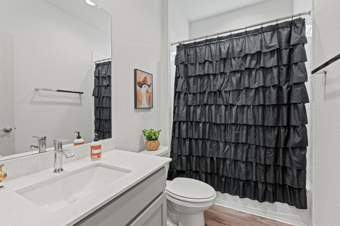 121 Tequilana Pass Leander, TX 78641 - Photo 22 of 39 a bathroom with a sink toilet and shower