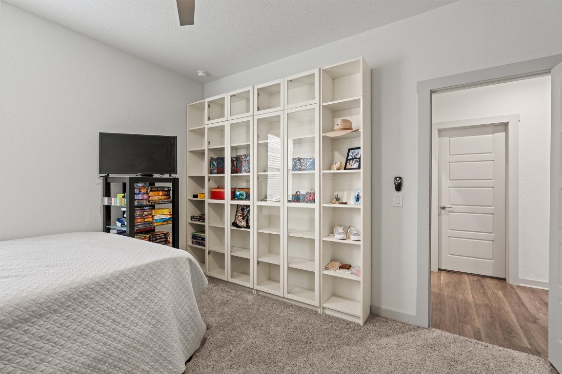 121 Tequilana Pass Leander, TX 78641 - Photo 25 of 39 a bed room with a bed and a television