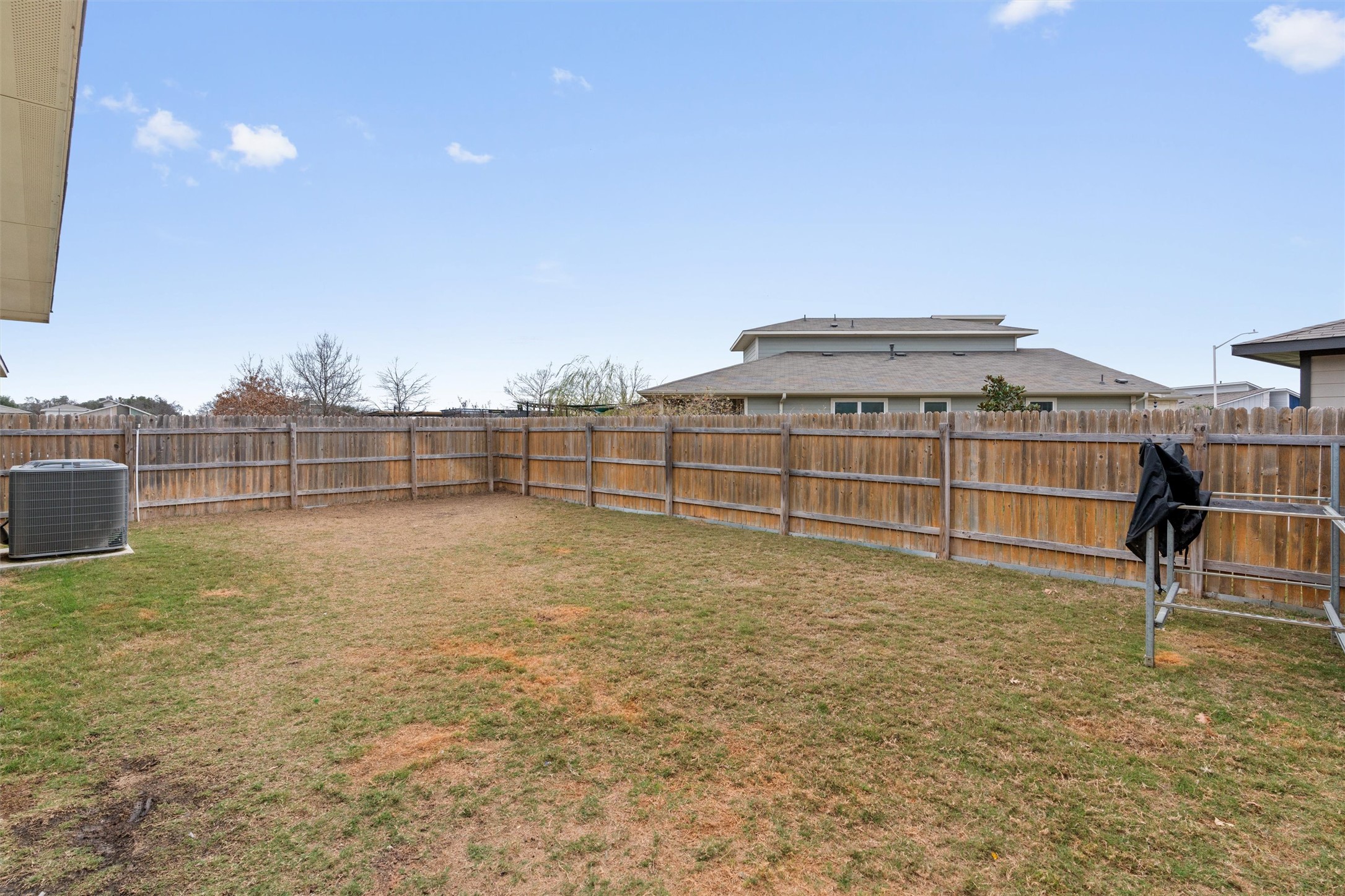 121 Tequilana Pass Leander, TX 78641 - Photo 35 of 39 a view of a terrace with a bench and trees