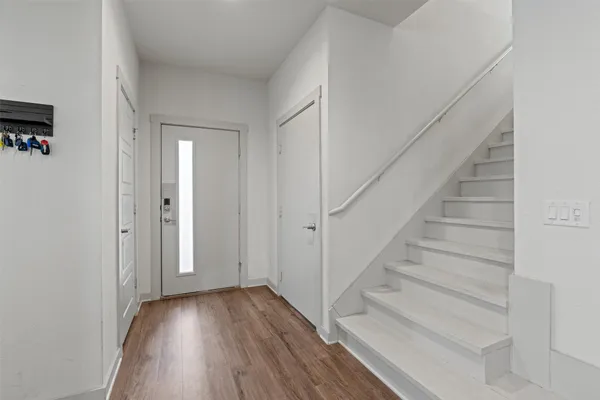 a view of entryway with wooden floor