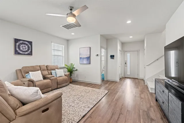 a kitchen with stainless steel appliances granite countertop a sink stove microwave and refrigerator