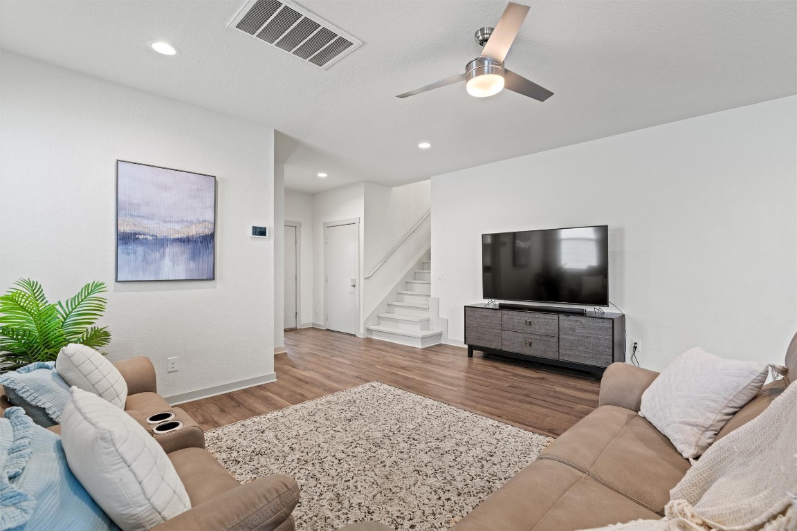 121 Tequilana Pass Leander, TX 78641 - Photo 7 of 39 a living room with furniture and a flat screen tv
